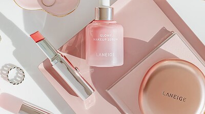 skincare and makeup products in elegant flat lay