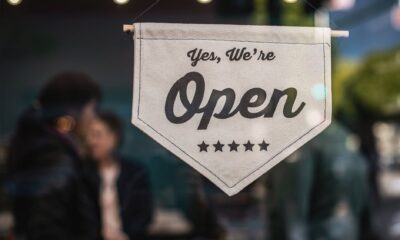 shallow focus photo of white open sigange, support small and local businesses