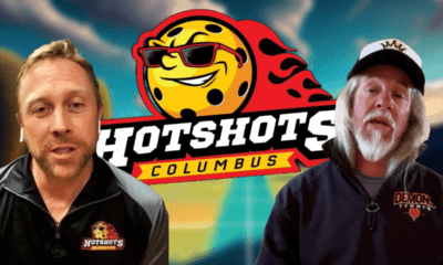 Vibrant logo of the Columbus HotShots team in Pro Pickleball, featuring a pickleball paddle and ball surrounded by flames."