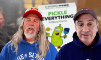 A group of people playing Pickle Everything, a word association game for pickleball enthusiasts.