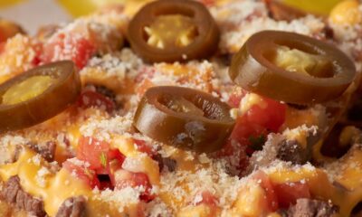 close up shot of nachos with jalapeno