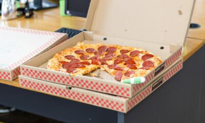 pizza with box on table