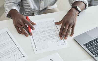 Procurement evaluators scoring tender responses against a published evaluation matrix