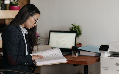 Bid manager checking a tender submission for errors before the deadline