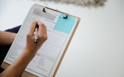 SME reviewing a pre-submission tender checklist before uploading a bid