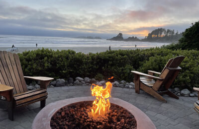 Tofino bon fire and surfing beach at sunset