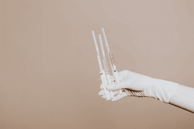 a person holding syringes with antihemophilic factor