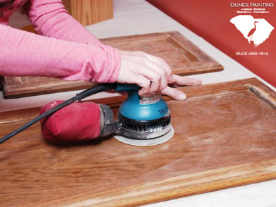 Sanding cabinets in Pawleys Island.