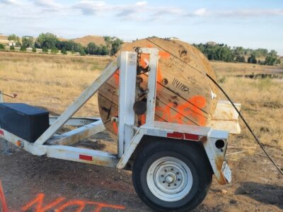 Fiber Optic Cable being deployed into HDD conduit for telecom project in Adams County, Colorado