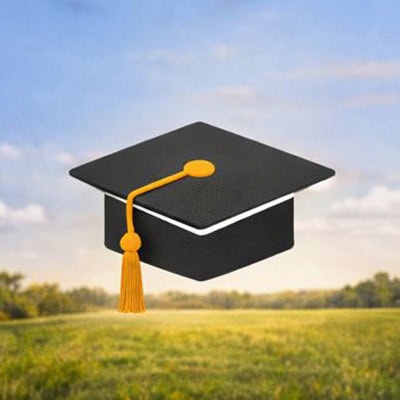 Graduation cap over a rural field representing education and scholarships