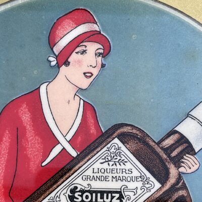 Liqueurs Soiluz: Uraltes Blechschild mit Celluloid-Überzug aus Belgien, datiert 1927