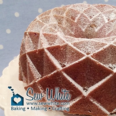 jubilee bundt cake with a dusting of icing sugar on