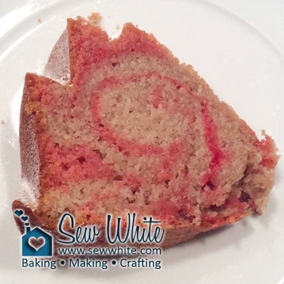 The swirl of red and white in the Strawberry and Banana Smoothie Bundt cake