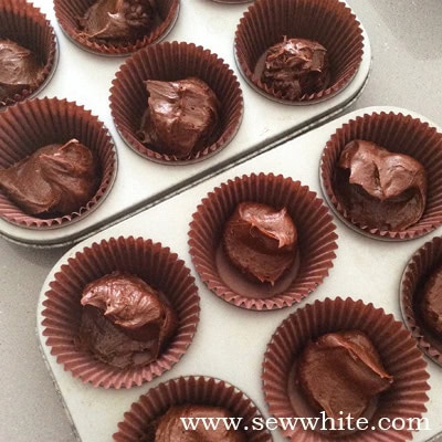 chocolate cakes in cupcake cases ready to be cooked