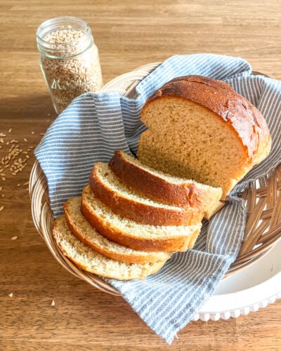 bread made with freshly ground wheat flour and a jar of wheat berries