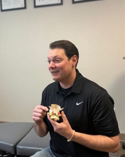 Dr. Henry explaining care in his Vancouver, WA chiropractic office