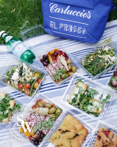 a range of the Carluccio's Picnic items on a blanket ready to enjoy