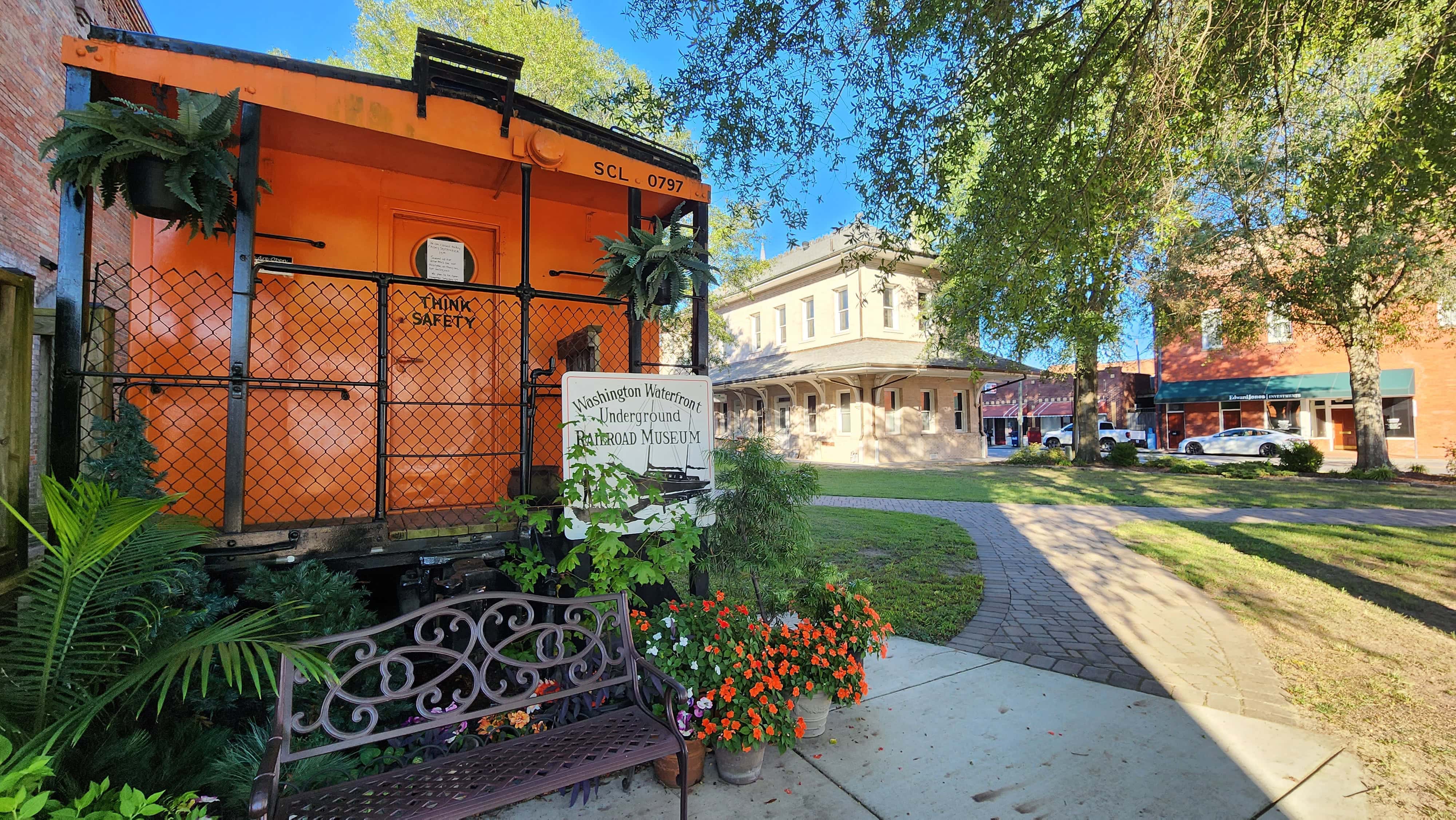 An old orange train car outside of the Washington Waterfront Underground Railroad Museum. This image is also the featured image in the article Exploring Your City: Local Sensory-Friendly Day Trips.