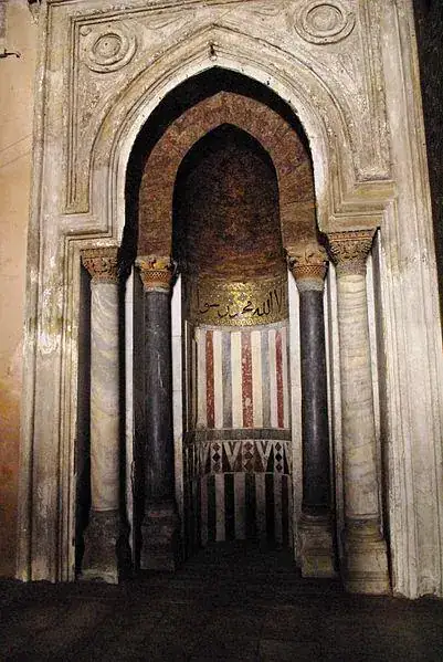 Decorated mihrab and carved architectural details in Ibn Tulun Mosque