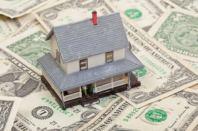 house on pile of money