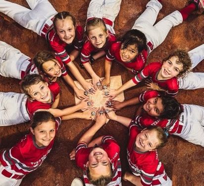 Houston youth softball team huddle hands together championship 2023