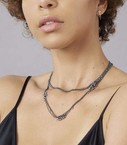 Photo of model wearing Kate Wood Jewellery's Pearl and Oxidised Silver Feather Necklace