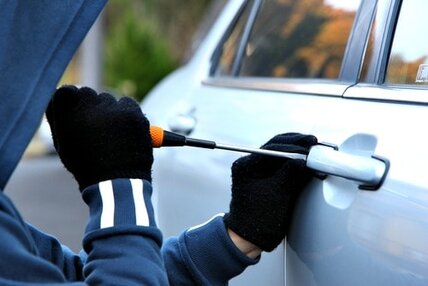 car thief with screwdriver