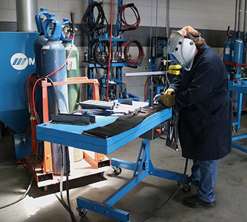 Man welding showing proper ergonomics