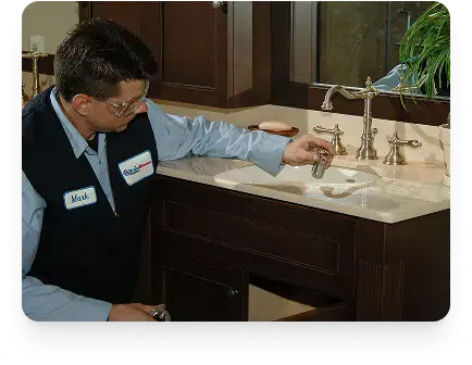 Inspecting a bathroom faucet in an Etobicoke vanity by Drain Rescue Plumbers