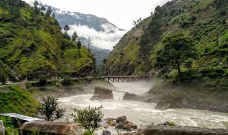 Tirthan River in Tirthan Valley Himachal Pradesh surrounded by mountains and forests
