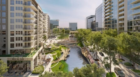 A lush Raleigh park with a water feature separates luxury apartments and office towers, offering visitors and residents a place to exercise and relax