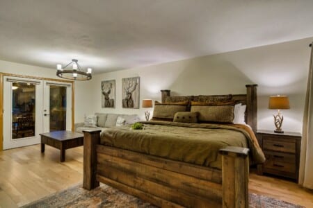 Spacious primary bedroom with en suite featuring an 42-inch TV for relaxing evenings.