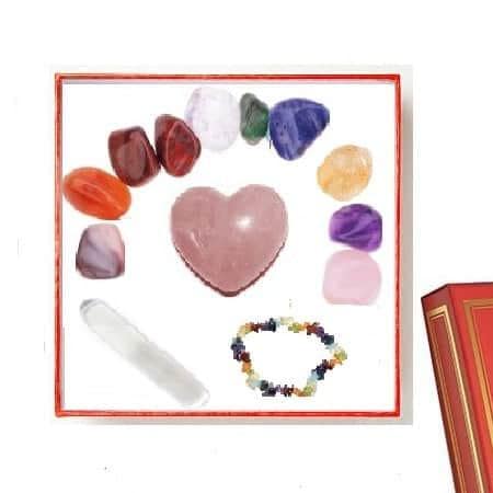 Aura Crystal Gift Set, a collection of colorful healing crystals, rose quartz heart, aura stone, beaded bracelet, and a white wand displayed in a white box.
