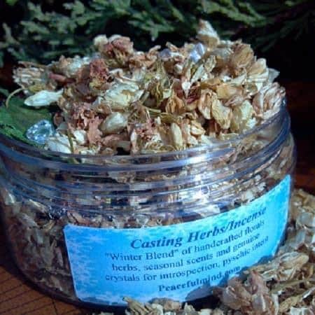 Winter Casting Herbs – Seasonal Ritual Blend with Clear Quartz, a jar of handcrafted dried herbal mixture with a blue label, used for seasonal rituals and introspection.