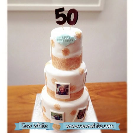 three tiered birthday cake with edible polaroids on and gold lace