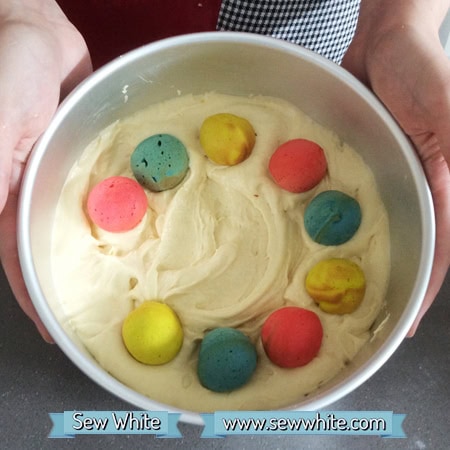 How to make a polka dot cake. Cake mixture with cake pops of colour ready to bake.