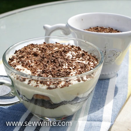 Tiramisu with Tea in cups and saucers decorated with chocolate shavings