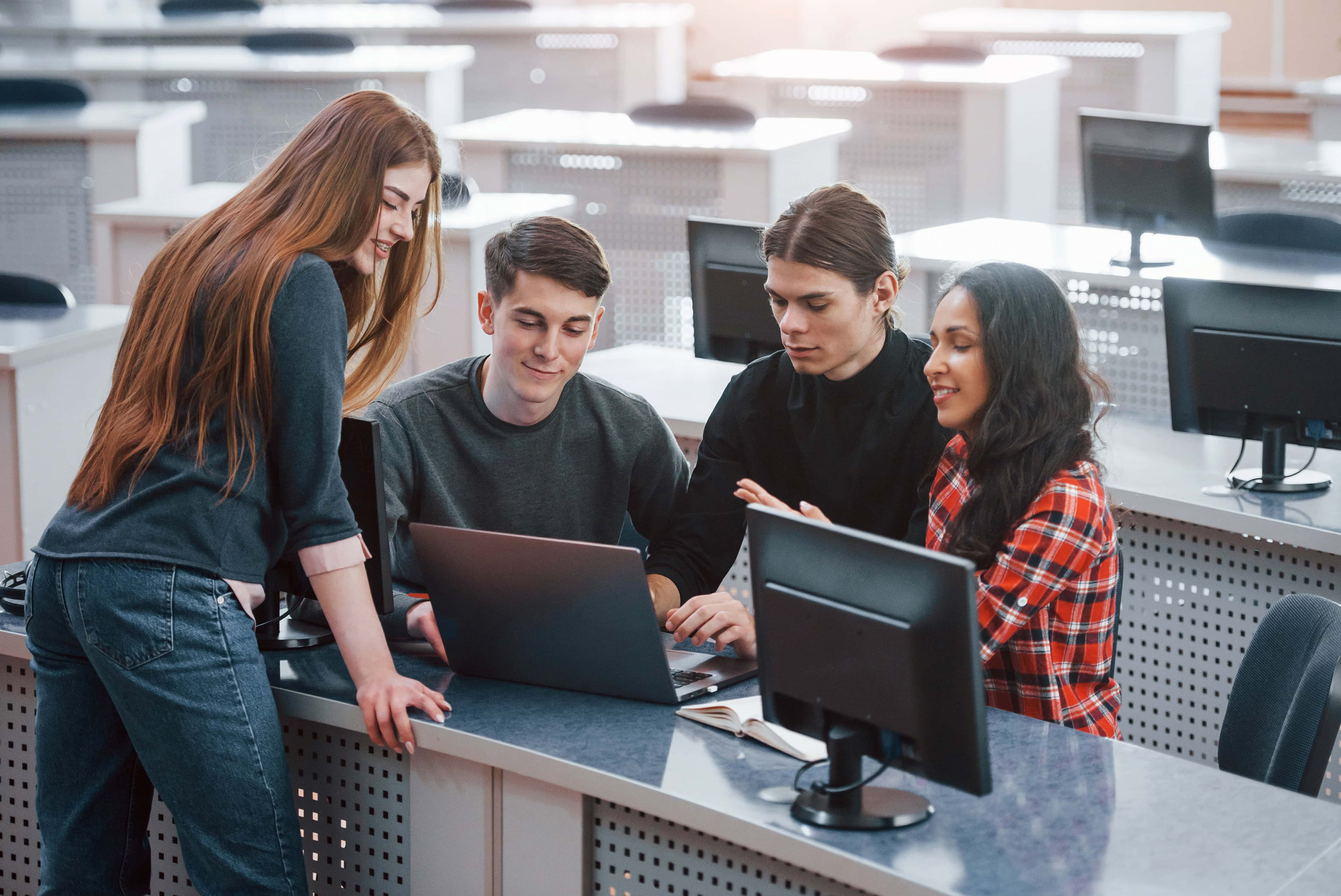 Active conversation Group of young people in casual clothes working in the modern office