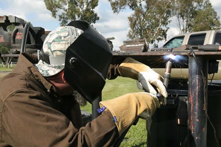 Image of a person welding in an out of position welding application