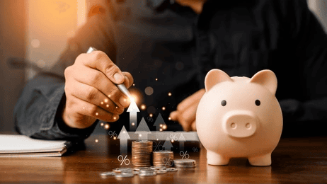 Piggy bank, coins, and rising financial arrows representing saving money and building financial security