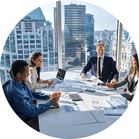 Business professionals discussing private equity strategies in a high-rise office.