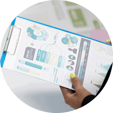 Business professional reviewing ESG and legal report with data charts and graphs.