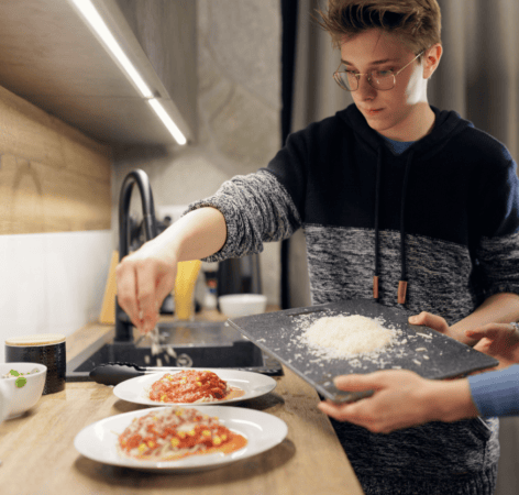 Family cooking a Hello Fresh meal together