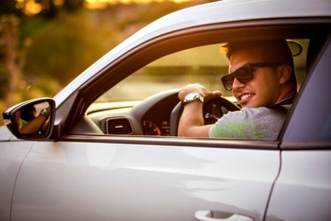 guy driving sports car