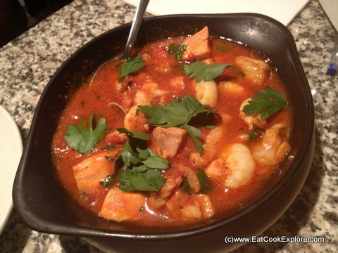 Spezzatino di pesce: Salmon, whiting, prawns and clams cooked in a light saffron & tomato sauce Pontis Italian Oxford Circus Italian Fish Stew