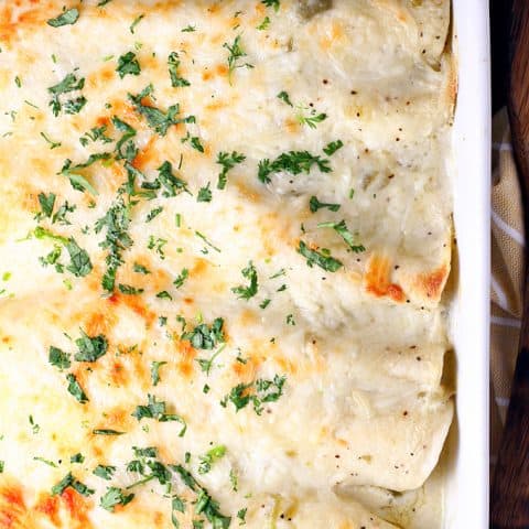 White Chicken Enchiladas with Green Chile Sour Cream Sauce