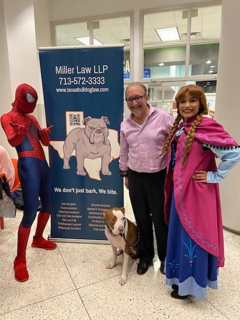 Adam Miller with Spiderman and princess at Houston children’s museum Halloween event