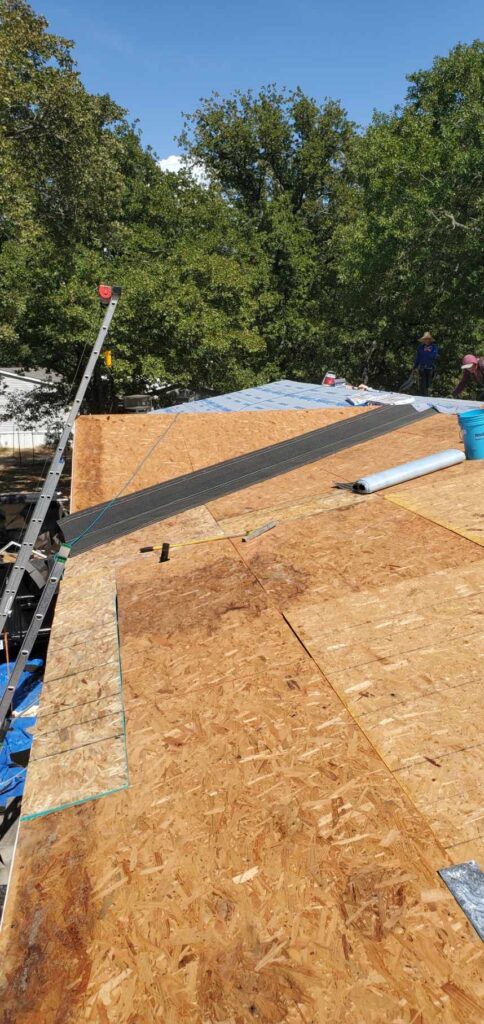 New OSB roof decking installation during a roof replacement by JDCC Roofing in Weatherford, TX