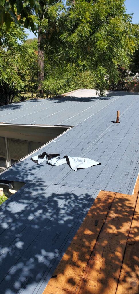 Roof underlayment installation in progress during a roof repair by JDCC Roofing in Weatherford, TX
