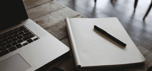 Laptop pen and paper